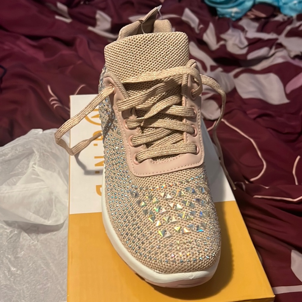 Pink, jeweled sneakers.